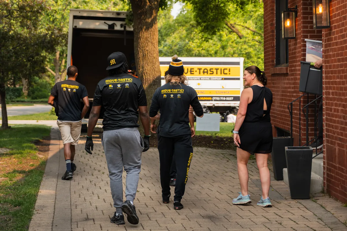 Move-tastic! movers talking with a customer