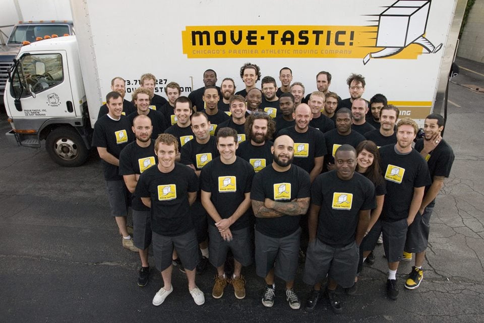 Professional moving crew gathered by their Move-Tastic truck in Chicago