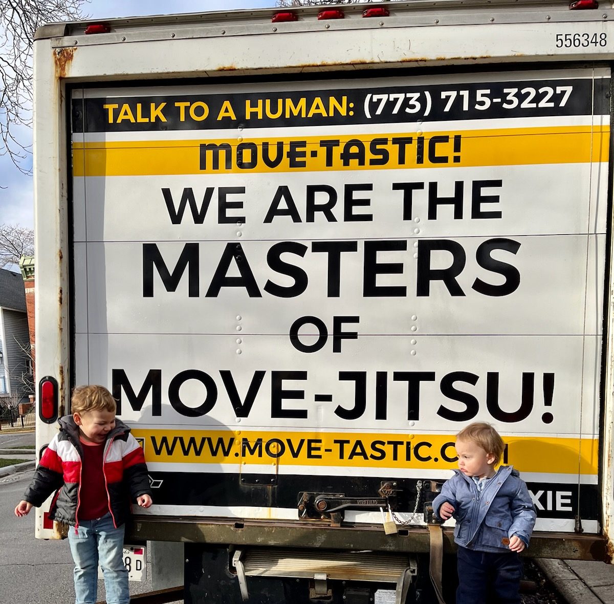 Two kids with a moving truck
