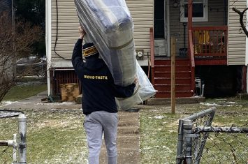Mover carrying a mattress