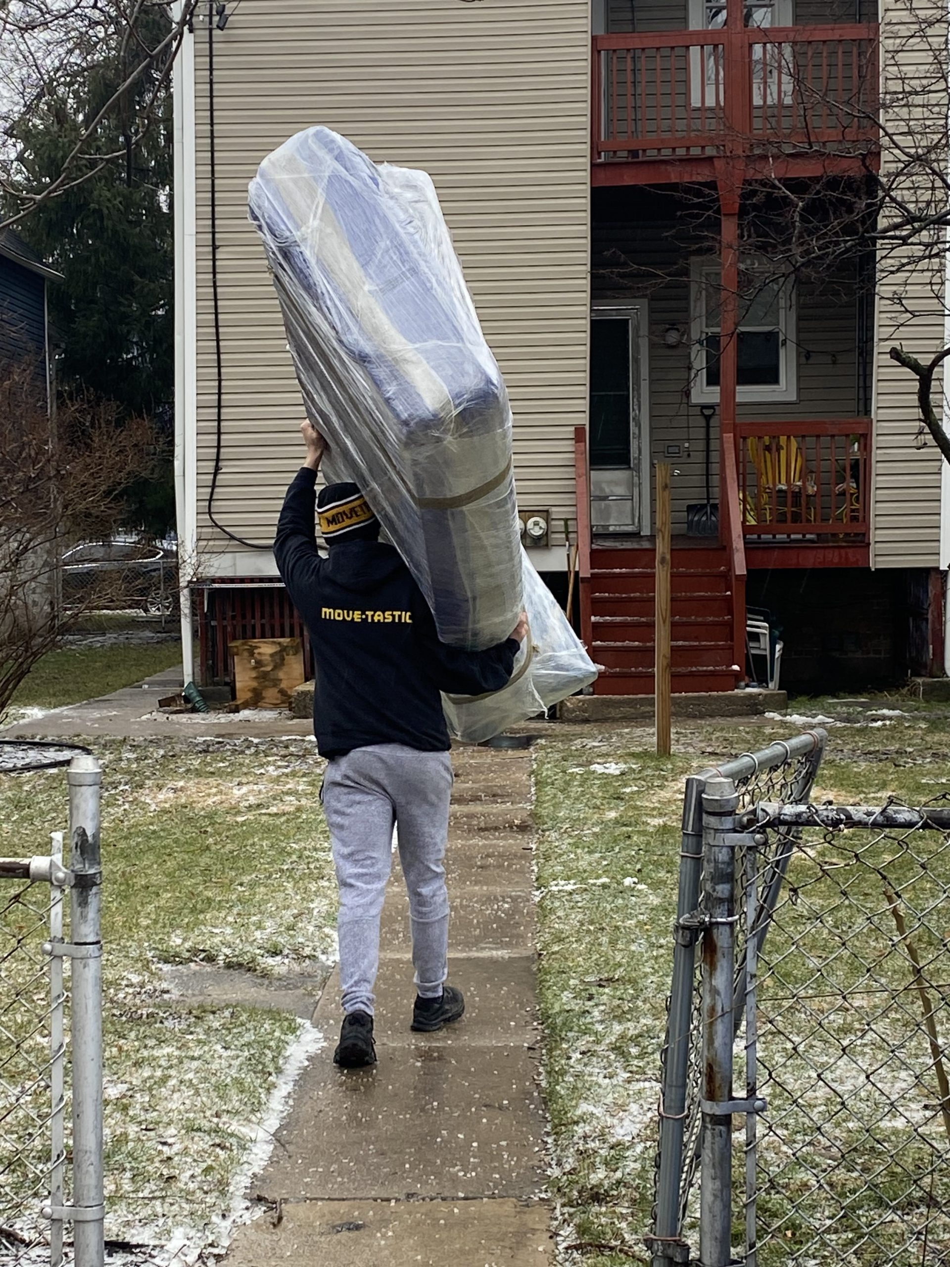 Mover carrying a mattress